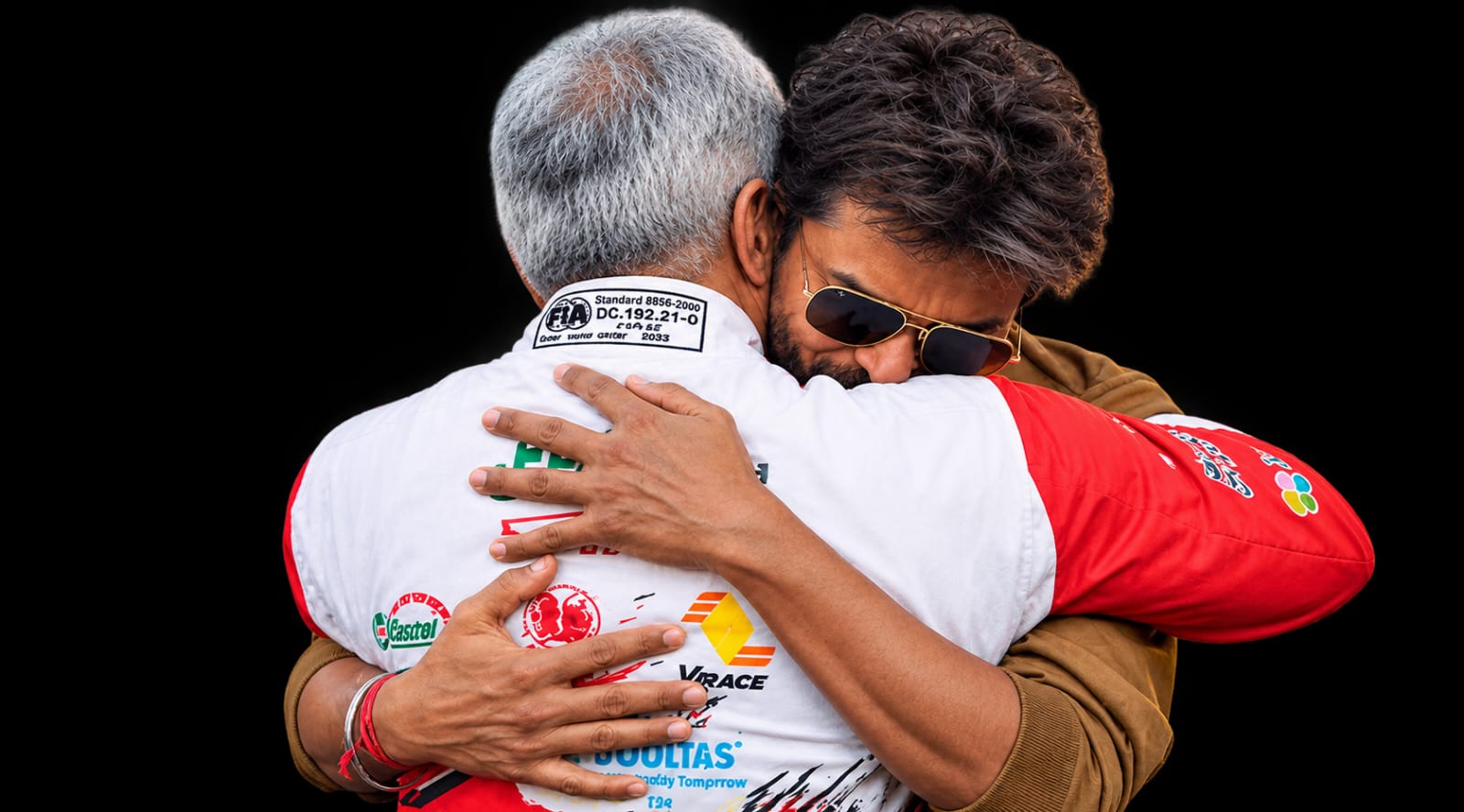 Vijay hugging Ajith Kumar at Silverstone Circuit during the 2026 Michelin Le Mans Cup